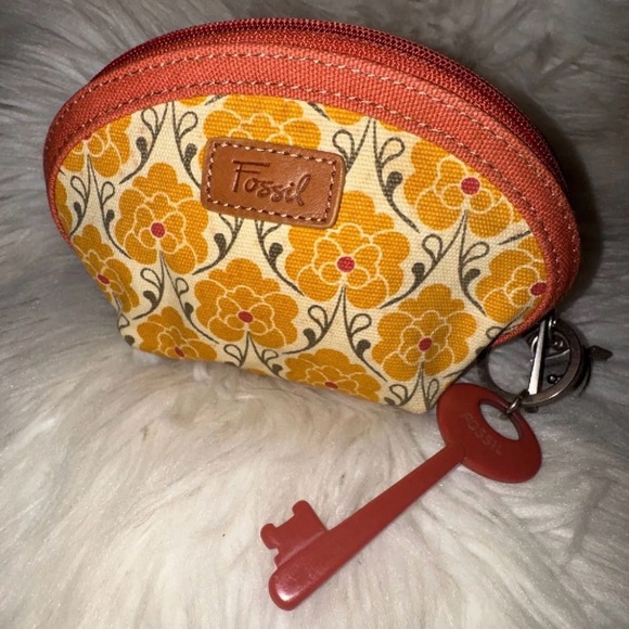 Fossil Handbags - Fossil canvas cosmetic pouch featuring a floral pattern and a signature key fob